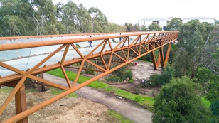 Deakin University Burwood pedestrian bridge uses BlueScope REDCOR® weathering steel to deliver a practical, paint-free structure requiring minimal maintenance compared with conventional structural steel